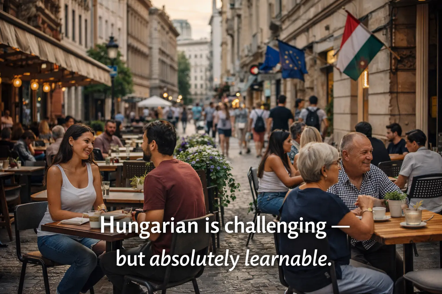 People chatting at outdoor cafés on a Budapest street, showing everyday Hungarian life and social connection.